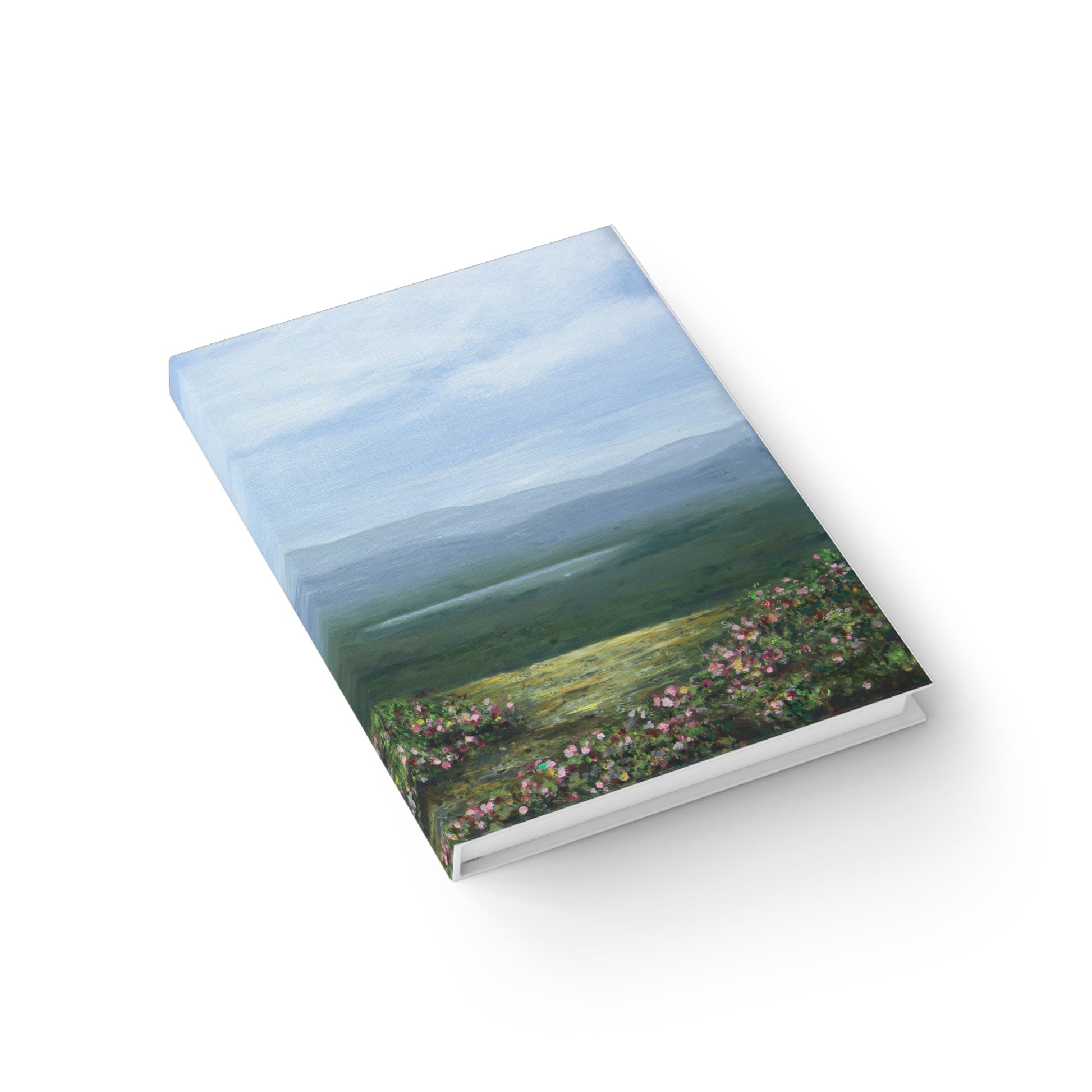 Book with a scenic cover featuring a landscape on a white background