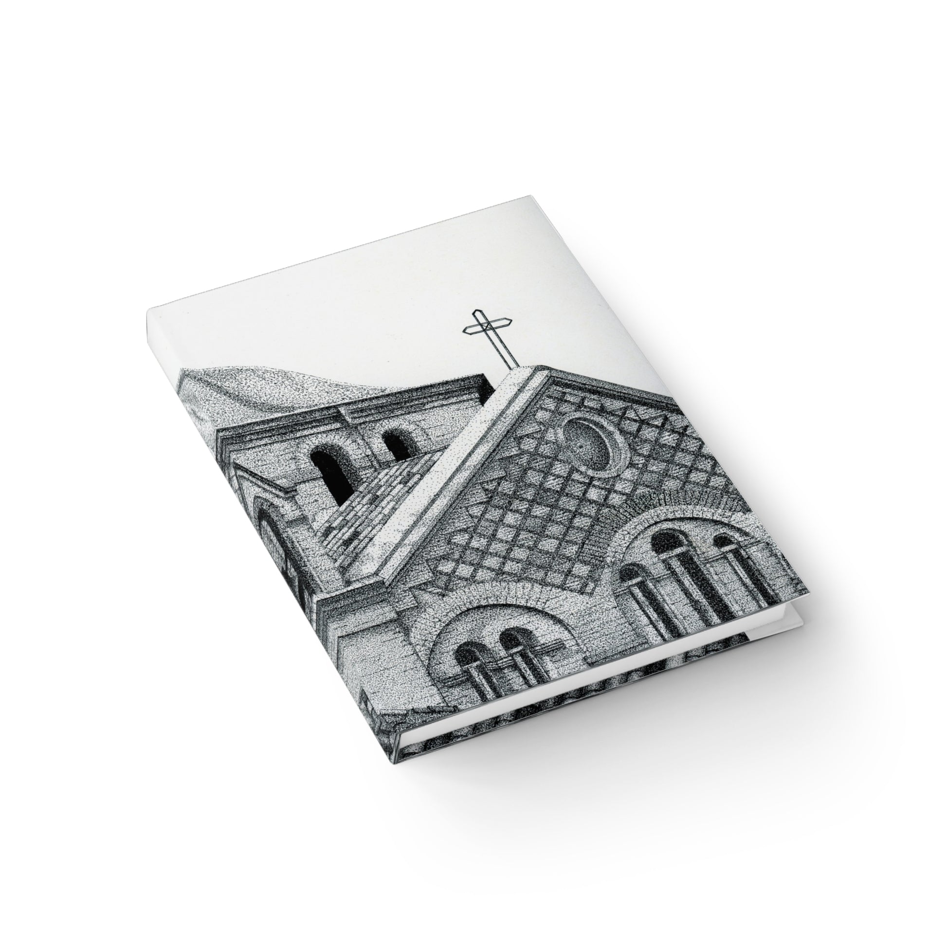 Notebook with a black and white illustration of a church on the cover